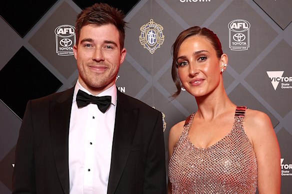 Zach Merrett of the Bombers and wife Alexandra Merrett arrive tonight.