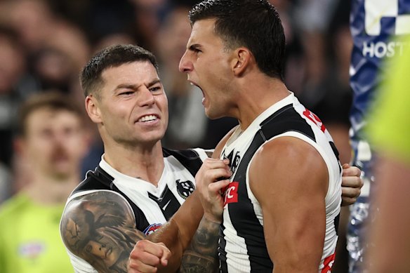 Nick Daicos (right) and Jamie Elliott (left) had nights to remember for Collingwood.