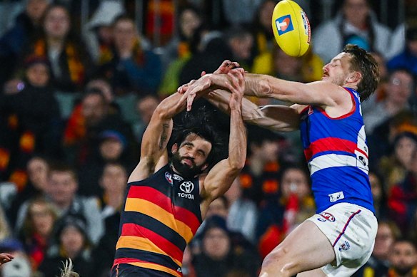 Wayne Milera of the Crows competes for  a mark against  Will Lewis of the Bulldogs.