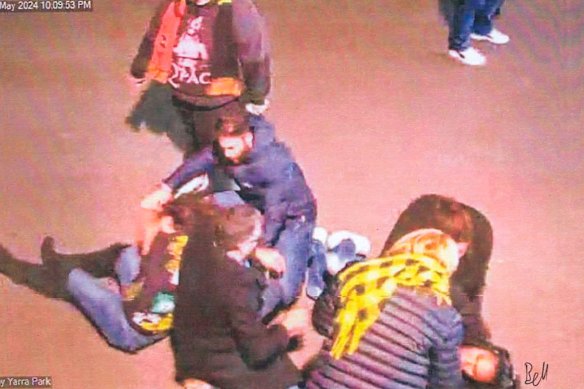 Lidia Thorpe, wearing black boots and a Richmond guernsey, is seen on the ground outside the MCG.