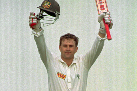 Mark Taylor celebrates a century during the first Test at Old Trafford in 1993.