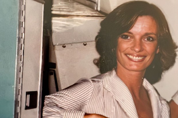 A retro photo of a young flight attendant
