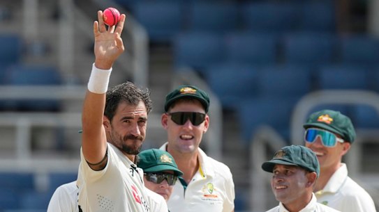 Mitchell Starc celebrates his five-wicket haul.