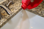 Boiling water is recommended over drain cleaning products as they can cause damage to seals in pipes.