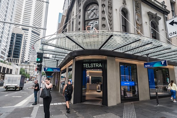 Syndey, NSW, Australia, February 18th 2024. General view of people walking past a Telstra store on a city street.