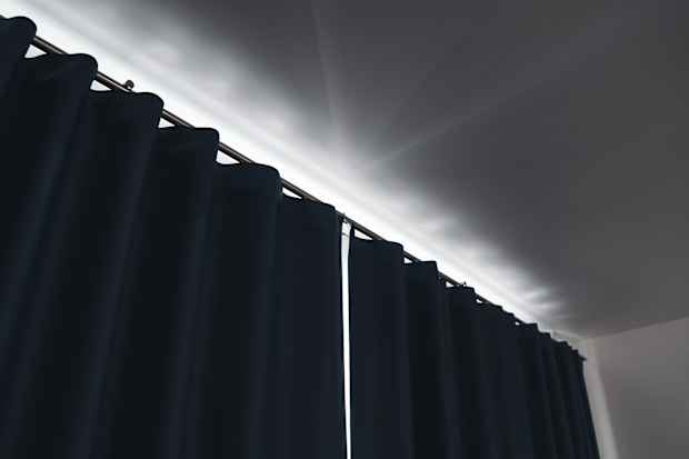 Blue blockout curtains closed.