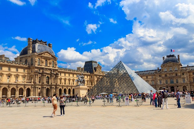 Museum of Louvre and pyramids in Paris, France