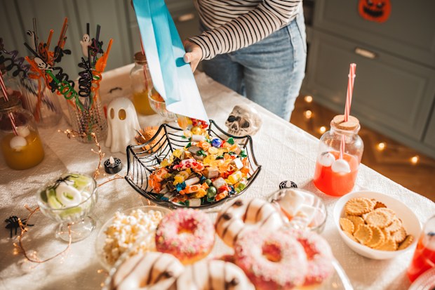 Stock image of Halloween treats being laid on a table