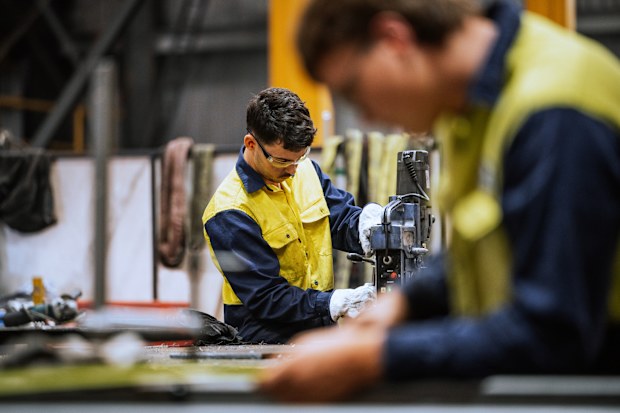 Stock image of men working in a warehouse