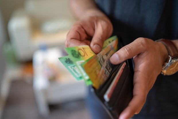 Man taking money out of wallet.