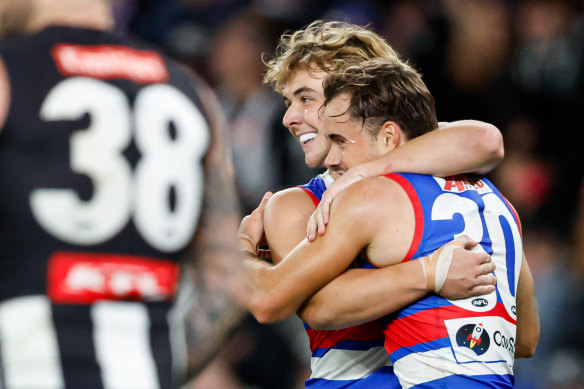MELBOURNE, AUSTRALIA - MAY 31: Lachlan McNeil of the Bulldogs (R) celebrates a goal with teammate Ryley Sanders during the 2024 AFL Round 12 match between the Collingwood Magpies and the Adelaide Crows at The Melbourne Cricket Ground on May 31, 2024 in Melbourne, Australia. (Photo by Dylan Burns/AFL Photos via Getty Images)