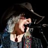 The singer, songwriter, and musician Mike Scott from The Waterboys  performing in 2024. 