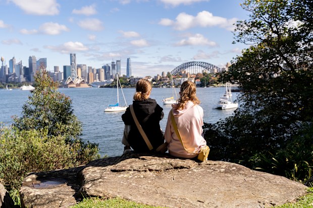 Two young girls are enjoying a beautiful Sydney view from Cremorne Point