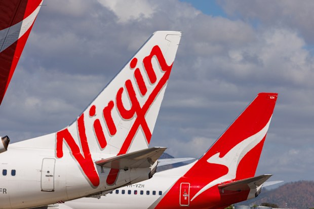Townsville, Queensland - 28 July 2021: Virgin Australia and Qantas tails on display at Townsville Airport in far North Queensland
