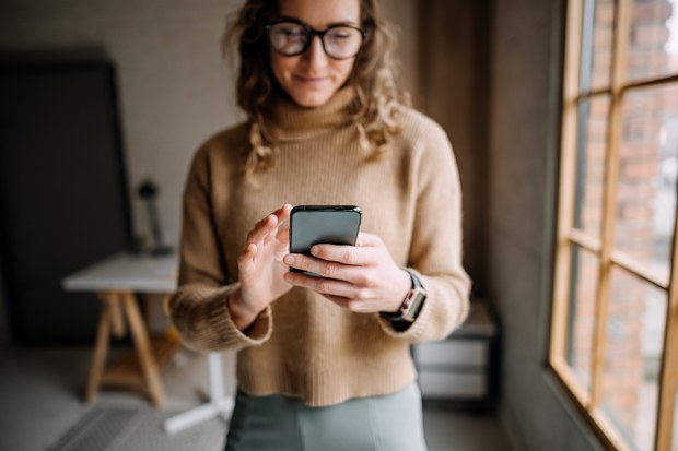 Stock image of a woman using a mobile phone