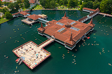 Aerial view about the thermal lake of Hévíz, with people swimming and sunbathing