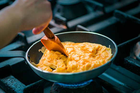 Stir and scrape the eggs slowly.