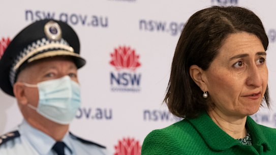 NSW Premier Gladys Berejiklian flanked by NSW Police Commissioner Mick Fuller on Saturday.