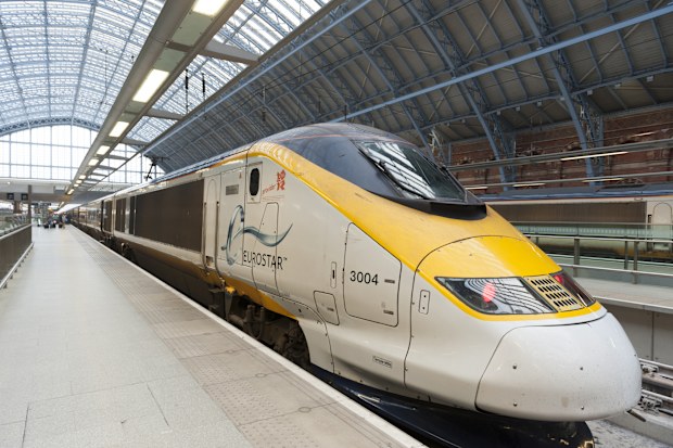Eurostar train at platform of St Pancras International railway terminus.