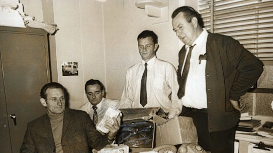CIB officers recover more money from the Qantas bomb hoax from a shop in Annandale on 6 August 1971.
