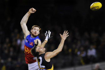 Daniel Merrett and Matthew Richardson compete for the ball.