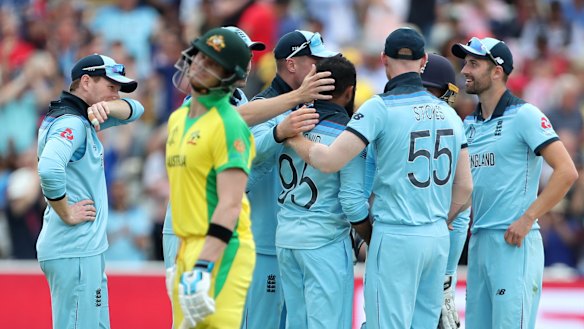 England players celebrates after the dismissal of key man Steve Smith.