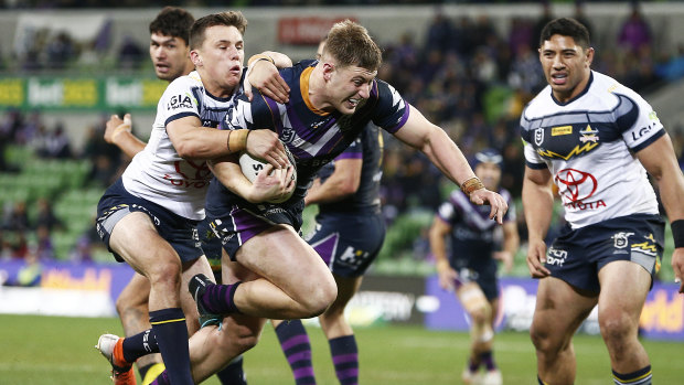 Crowning glory: Max King caps scores his first try for the Storm against North Queensland Cowboys.