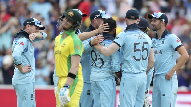 England players celebrates after the dismissal of key man Steve Smith.