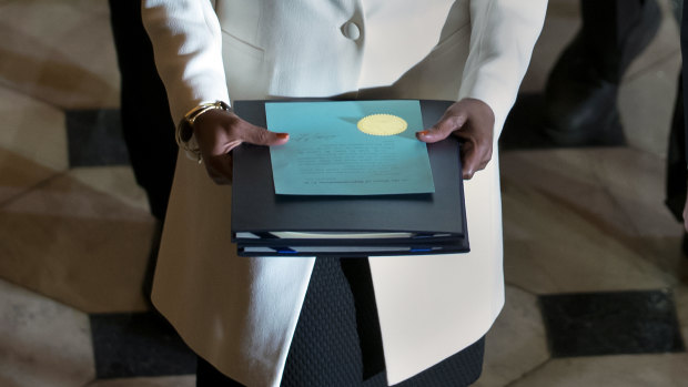 Clerk of the House Cheryl Johnson carries the articles of impeachment against President Donald Trump to the Senate, on Capitol Hill in Washington.