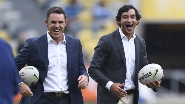 Brad Fittler and Johnathan Thurston share a laugh before resuming their duties as TV commentators.