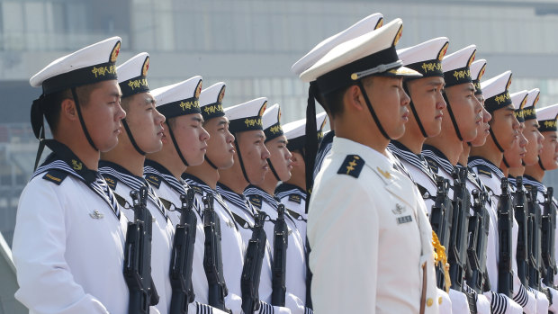 Chinese People’s Liberation Navy sailors stand in formation.