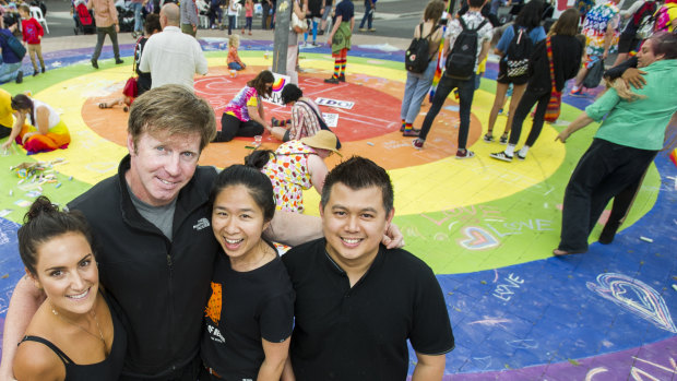 Braddon's United Retailers and Traders, Saloon Hair and Beauty's Sarah Wright, Kel Watt and Orr and Pop Intraprasit from Elemental Cafe would like to see the rainbow roundabout extend to other parts of the city. 