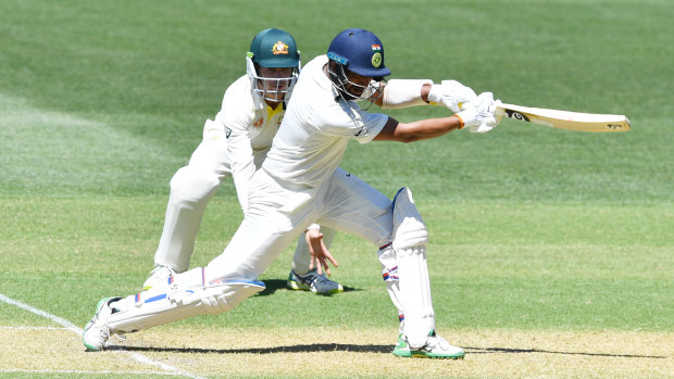 Stalwart: Pujara drives during a knock antithetical to the modern crash and bash game.
