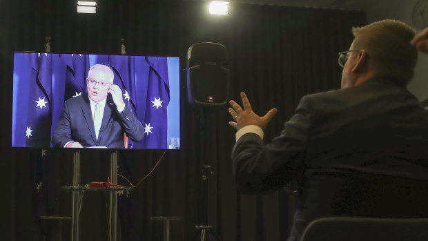 Prime Minister Scott Morrison unable to hear a question from Andrew Clennell of Sky News due to technical issues.