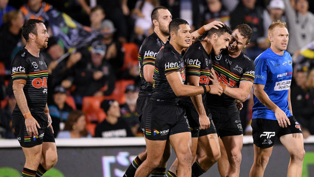 Point of order: Nathan Cleary's teammates mob the halfback after his field goal  heroics, but James Maloney, left, warns they have yet to hit their straps.