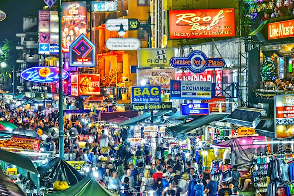 Khao San Road, illuminated at night.