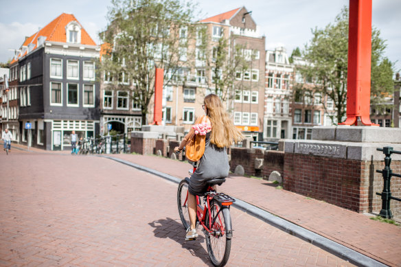 Amsterdam has some 400 bridges and a bicycle is the appropriate way to explore them. 