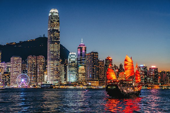 A traditional junk against the spectacular backdrop of Hong Kong’s skyscrapers.