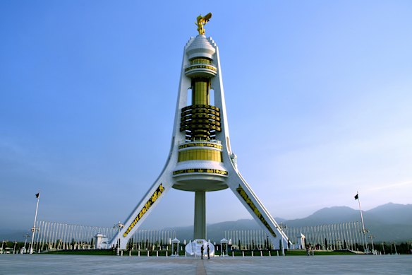 The futuristic Arch of Neutrality stands astride the Kopet Dag mountains, separating Turkmenistan from Iran.