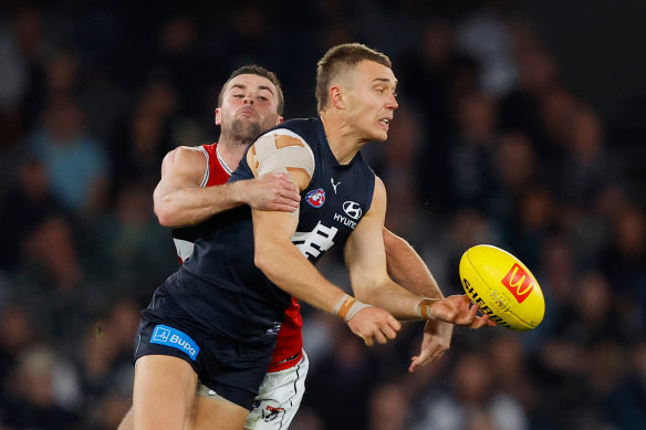 Carlton captain Patrick Cripps gets attention from St Kilda’s Brad Crouch.