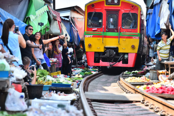 Crowds gather for the passing train.