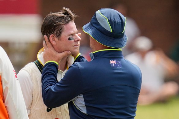 Australia’s Steve Smith receives medical attention during day four.