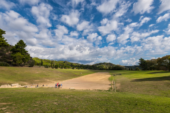 Race across the original start and finish lines in Olympia, Greece.