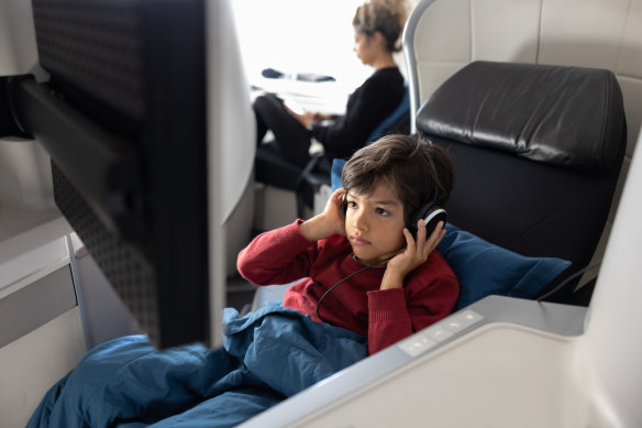 Some airlines consider children travelling in a different class to their parents as unaccompanied minors.