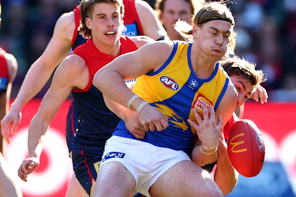 Harley Reid of the Eagles is tackled by Jack Viney of the Demons in 2024.