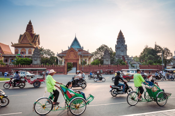Cyclo drivers remain a fixture of Phnom Penh.