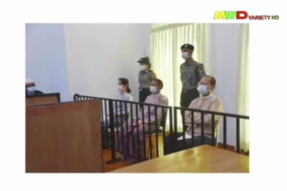 An image of Aung San Suu Kyi, left, in court in Naypyitaw last month was shown on military-run television.