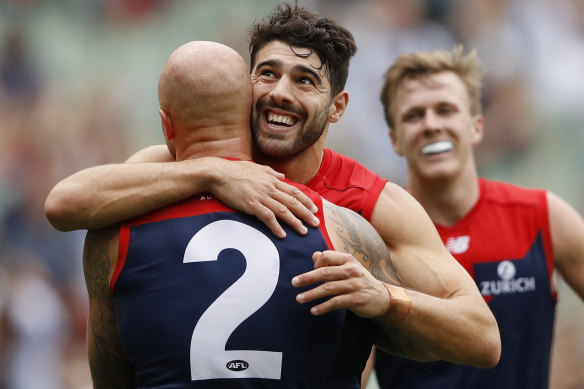 Christian Petracca hugs Nathan Jones. 