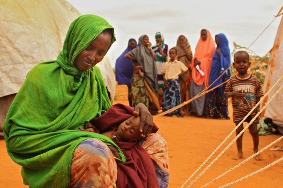 Ladhan Waraq with her daughter Sahlan Mohammed on the outskirts of Dadaab refugee camp in Kenya, near the Somalian border, in 2011.