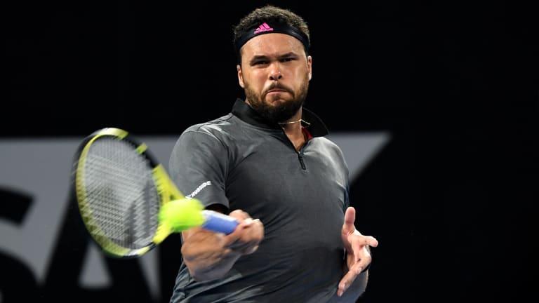 Jo-Wilfried Tsonga of France plays a shot during his quarter final match against Alex De Minaur.